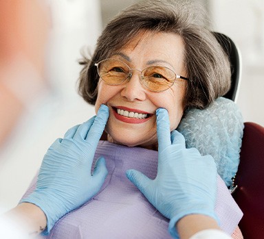 Dentist looking at patient's smile