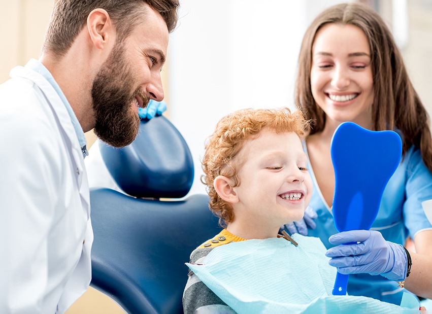 Boy smiling at the dentist