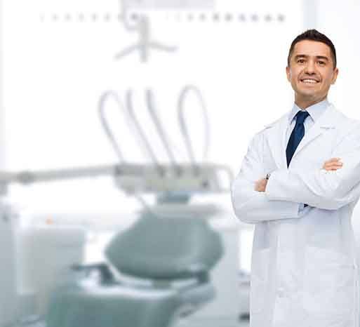 Smiling dentist in exam room