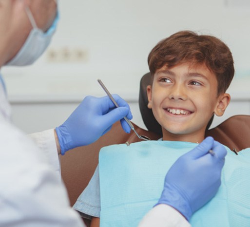 Preteen boy smiling at his dentist