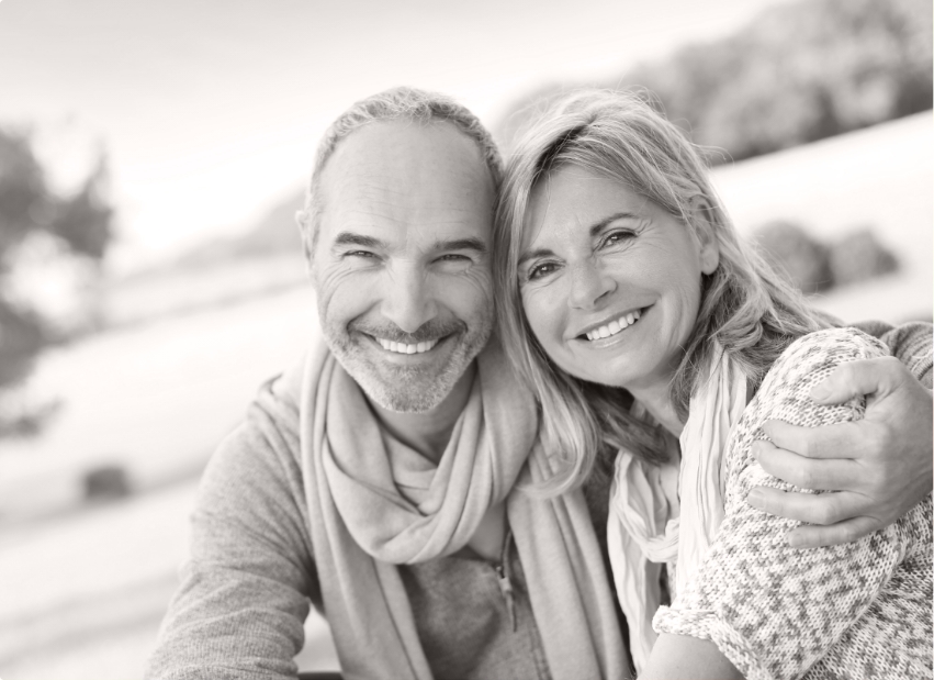 Man and woman with flawless smiles thanks to smile design treatment